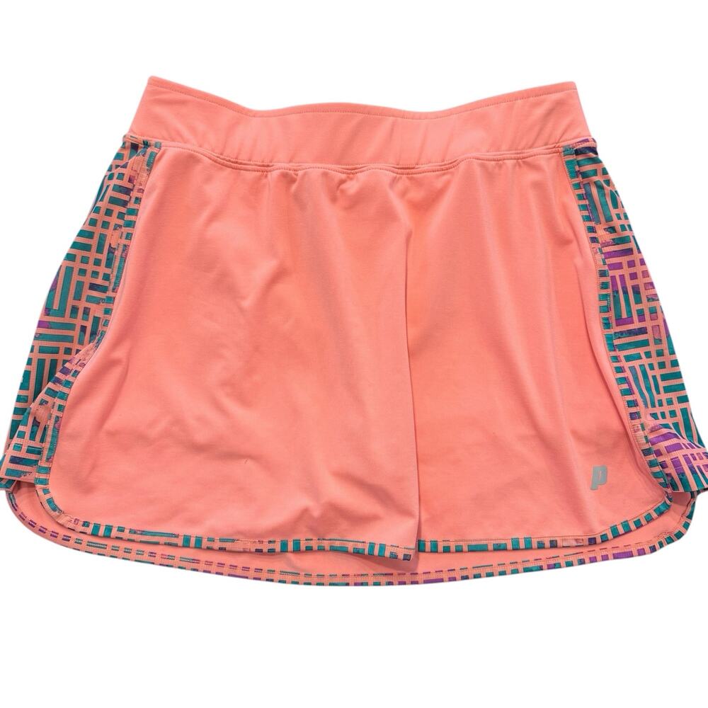 Prince tennis skort, coral pink with green/purple pattern on side, Medium